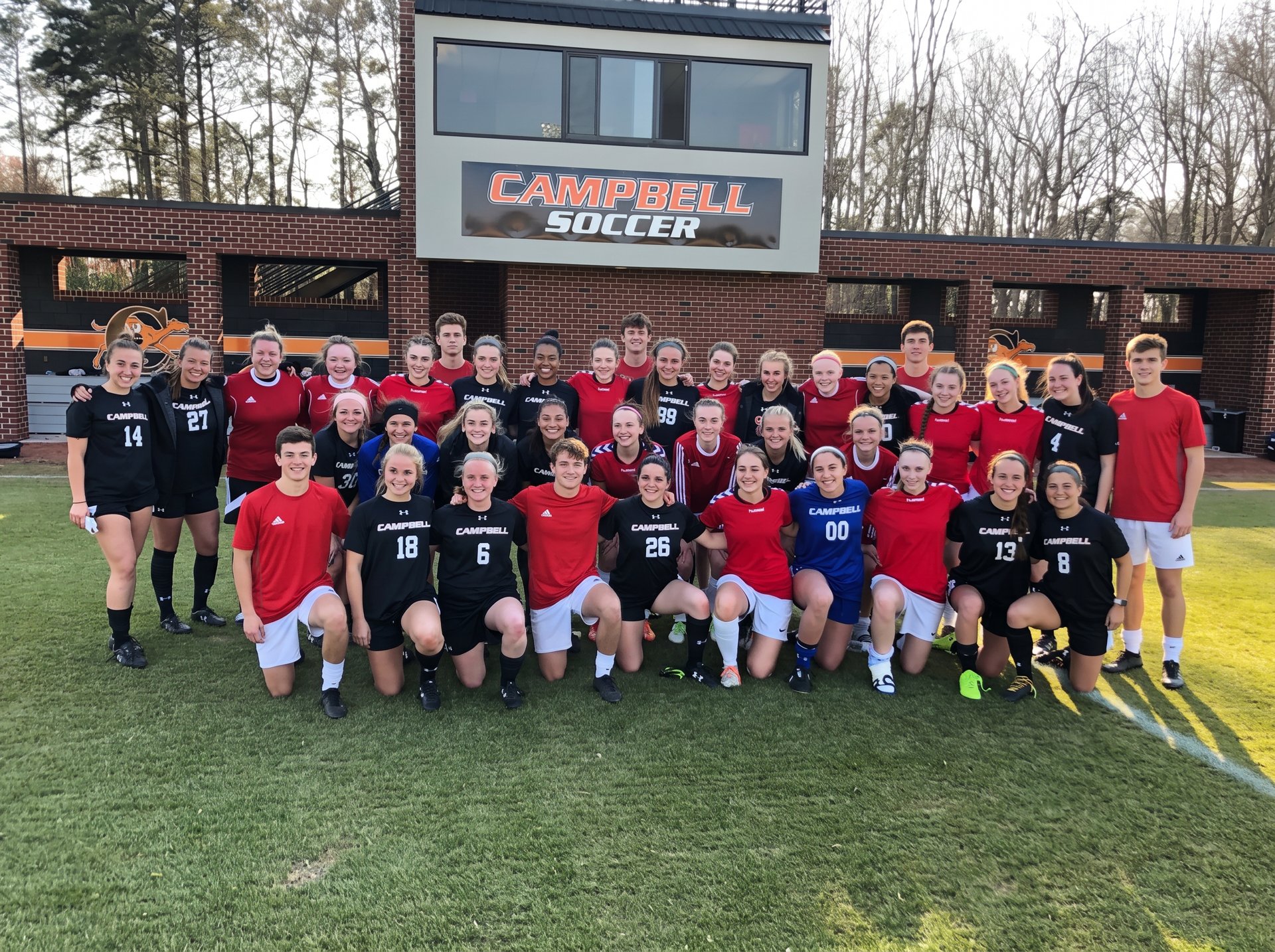 Stride USA boys' and girls' squads pictured together at an NCAA college soccer venue in North Carolina
